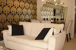 Living room with white leather sofa