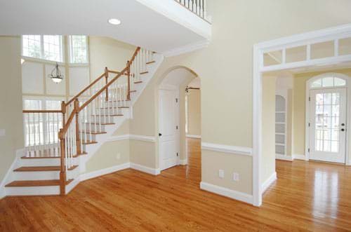 Clean empty living room with hard wood flooring